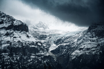 epic light on Ischmeer Glacier in Grindelwald during a snowstorm