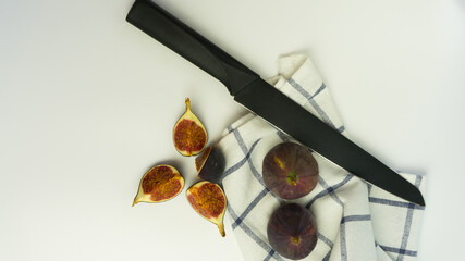 Fresh delicious figs on a wooden Board with a white background.