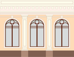 Facade of the building, one floor with windows and decorative elements of a column, balustrade.