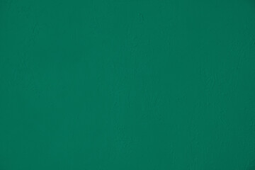 Dark green low contrast soft Concrete textured background to your concept or product. Natural color trend.