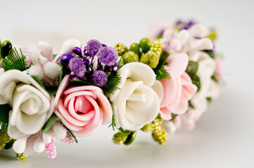 Hair hoop decorated with delicate color artificial flowers.