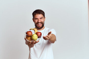 man with fresh fruit in a glass cup gesturing with hands vitamins health energy model bushy beard mustache