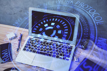 Double exposure of desktop computer and technology theme hologram. Concept of software development.