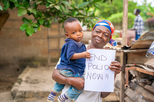 portrait of African toddler and a woman, with a note-polio awareness concept