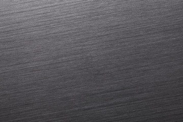 Brushed aluminum surface texture. Abstract dark background