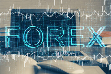 Double exposure of forex graph and work space with computer. Concept of international online trading.