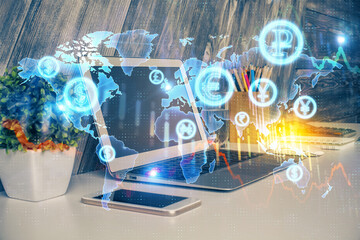 Double exposure of graph and financial info and work space with computer background. Concept of international online trading.