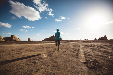 Fototapeta premium Fitness woman trail runner cross country running on sand desert