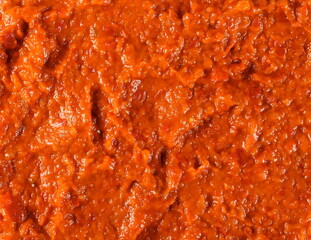 Ajvar, red paprika, pepper and eggplant dish background and texture