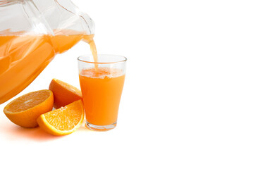 Fresh orange juice is poured into a glass with fresh orange slices cut in half on white background with copy space, top view, banner
