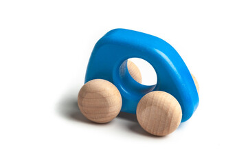 Small blue wooden toy car on white background