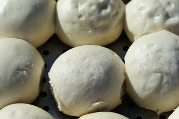 Chinese food steamed buns in a container
