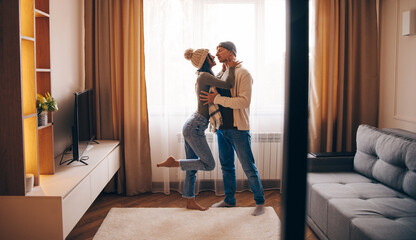 Close up portrait of young attractive romantic couple hugging and kissing