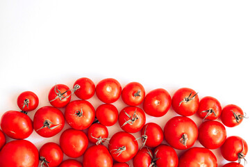 Flat lay shot of ripe red tomatoes on a white background. Healthy food.