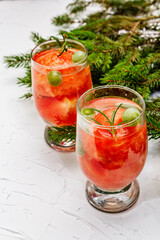 Festive low alcoholic fruit cocktail with watermelon, green grape and rosemary