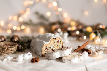 Christmas stollen on wooden background. Traditional Christmas festive pastry dessert. Stollen for Christmas.