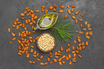 Pine nuts in wooden boxes. Cedar oil
