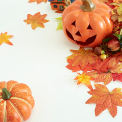 Halloween decorate pumpkins with autumn leaves