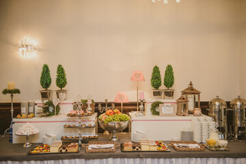 Beautifully decorated wedding table and other details at wedding hall. Wedding day.