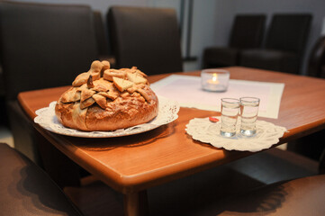 Traditional polish greeting the bride and groom by the parents with bread and salt. Vodka also in glasses