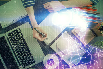 AR hologram over woman's hands taking notes background. Concept of augmented reality. Multi exposure