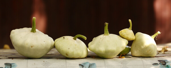 patisson bush pumpkin lay on table outdoor still life