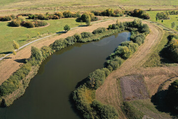 Aerial view of the edge of a rainwater retention basin in the lowlands