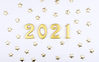Happy New Year 2021. Sparkling gold numbers on white background with stars. object for design holiday greeting card,