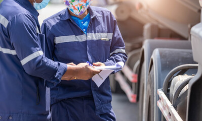 Truck drivers hand holding clipboard Check the product list, Preforming a pre-trip inspection on a...