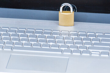 locked padlock placed on a laptop, digital security concept