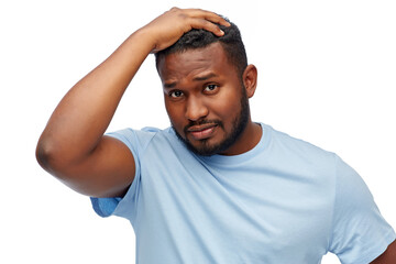 people, grooming and hairstyle concept - portrait of unhappy young african american man touching his hair over white background