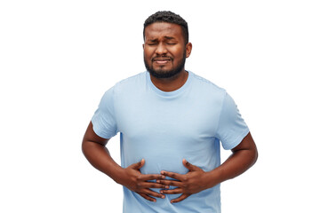 people, healthcare and health problem concept - unhappy man suffering from stomach ache over white...