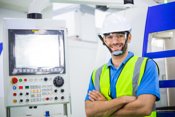 Portrait of confident male engineer foreman in safety helmet smile in arms crossed stand in front of factory production. man operating machine at industrial plant. men at work concept. copy space