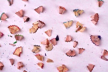 Pencil shavings on white background. Colorful pencil chips.