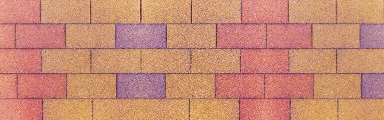 Panorama of Vintage yellow cobblestone pavement pattern and background
