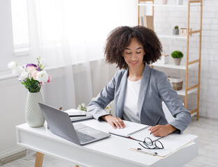 Adopt an order from clients in online office at home during outbreak. Cheerful african american...
