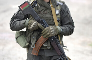 Flag of Belarus on assault rifle butt. Collage.