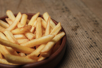 french fries on a wooden background