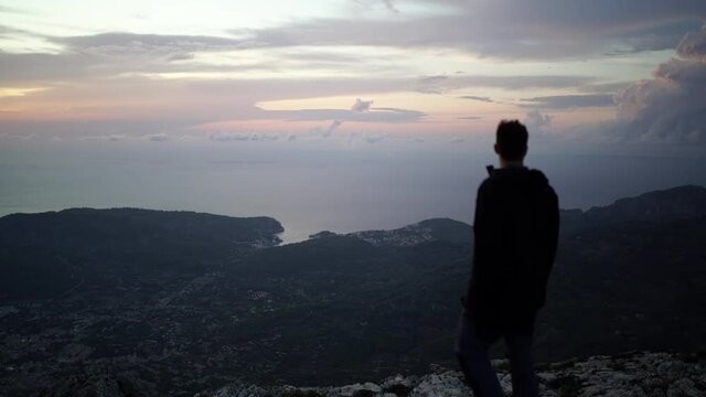 Video of a man enjoying Soller views from the top of a mountain