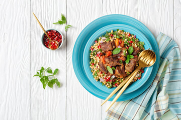 lamb stew with pearl couscous and pomegranate