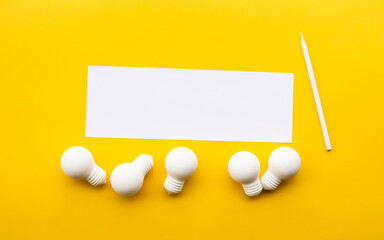 Business creativity / think outside the box concepts with lightbulb on yellow background