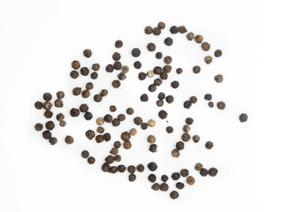 Black pepper, herbs, spices in top view.