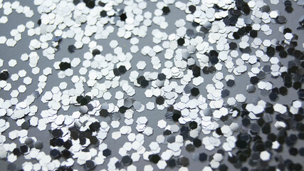 Shiny silver confetti on a white background. For birthday, christmas, wedding, valentine's day, new year
