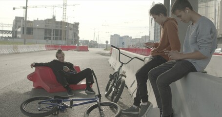 Tired bored friends with bikes