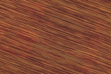 The texture of the fabric , located diagonally, is a beautiful brown color with a clear interweaving of threads.  Coarse cloth, burlap.