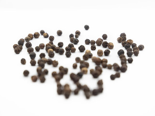 Black pepper, herbs, spices in top view.