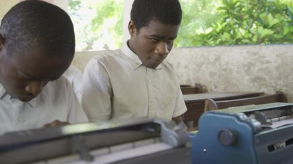Teacher working with blind and partially sighted students. Africa