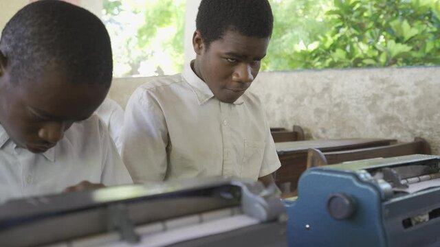 Teacher Working With Blind And Partially Sighted Students. Africa