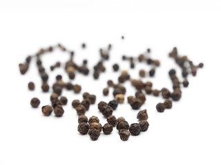 Black pepper, herbs, spices in top view.