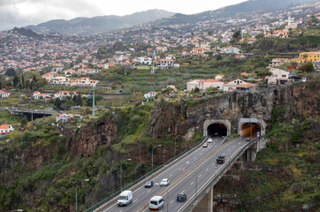  Tunnel with a panorama of the city of Funchal in the background. Madeira, Portygal.